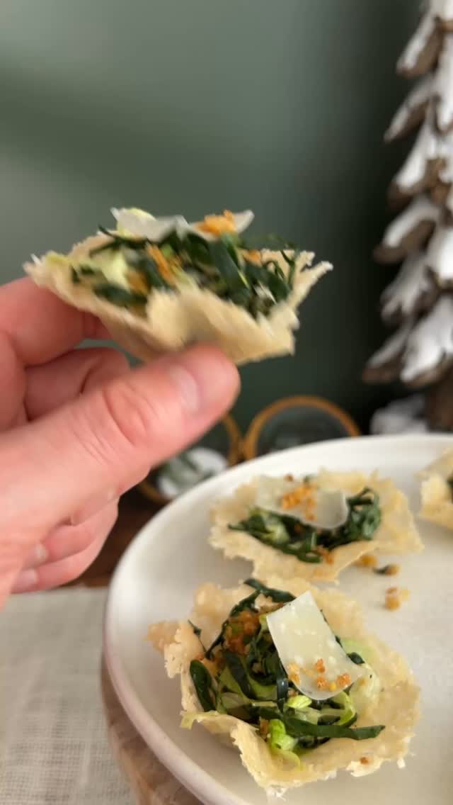 DAY 3 of the 24 DAYS OF DRESSING! Full Recipe Below! 

Also, we are still giving away one cookbook a day until the end of this series! Comment BOOK for a chance to win a copy of my first cookbook, Salad Whisperer. 

Mini Kale Caesar Parmesan Cups

• Parmesan Cups 2-3 cups freshly grated Parmesan (grated using a microplane)
• Salad  1/2 cup panko bread crumbs
2 tbsp extra-virgin olive oil
1/2–3/4 tsp seasoned salt 
1/2 tsp Italian Seasoning
4 tbsp Pecorino cheese, divided 3 cups chopped romaine 3 cups thinly sliced kale 1 1/2 ounces Parmesan for finishing About 3 tablespoons Eggless Caesar Dressing (recipe below)
• Eggless Caesar Dressing (makes about 1 1/4 cups) 4 tablespoons lemon juice 1 tablespoon capers, drained 1/2 tablespoon Dijon 3 garlic cloves 1/2 teaspoon Worcestershire
2/3 cup neutral oil 2 tablespoons olive oil Salt and pepper

Parmesan Cups: Heat oven to 375°F. On a parchment-lined sheet pan, make six 3-in circles using 3 tbsp grated Parmesan per circle. Spread thinly. Bake about 7 minutes until lightly golden. Transfer to an upside down mini muffin tin to make the cups.
Crumbs: Heat oil in a 10” skillet over medium. Add crumbs and toast for a few minutes. Add seasoned salt and oregano and continue toasting, stirring often, until golden, about 3-4 minutes. Remove from heat, stir in Pecorino, and cool on a paper-towel lined plate.
Salad: Toss romaine and kale with a few tablespoons dressing and the remaining pecorino. Season to taste.
Dressing: Blend lemon juice, capers, Dijon, garlic, and Worcestershire until finely chopped. Slowly stream in neutral oil, then olive oil. Season with salt and pepper.
Build the Cups: Fill each Parmesan cup with a small handful of the kale Caesar. Top with a pinch of crumbs and a little fresh Parmesan. Serve immediately so the cups stay crisp.

Giveaway Rules:  • No purchase necessary. US only. 18+. One winner selected at random by 1/1/26 and contacted by DM. Giveaway not sponsored or endorsed by Instagram. If selected, you agree to share a mailing address so we can send your prize. Void where prohibited.
#thesaladwhisperer #recipeadventcalendar