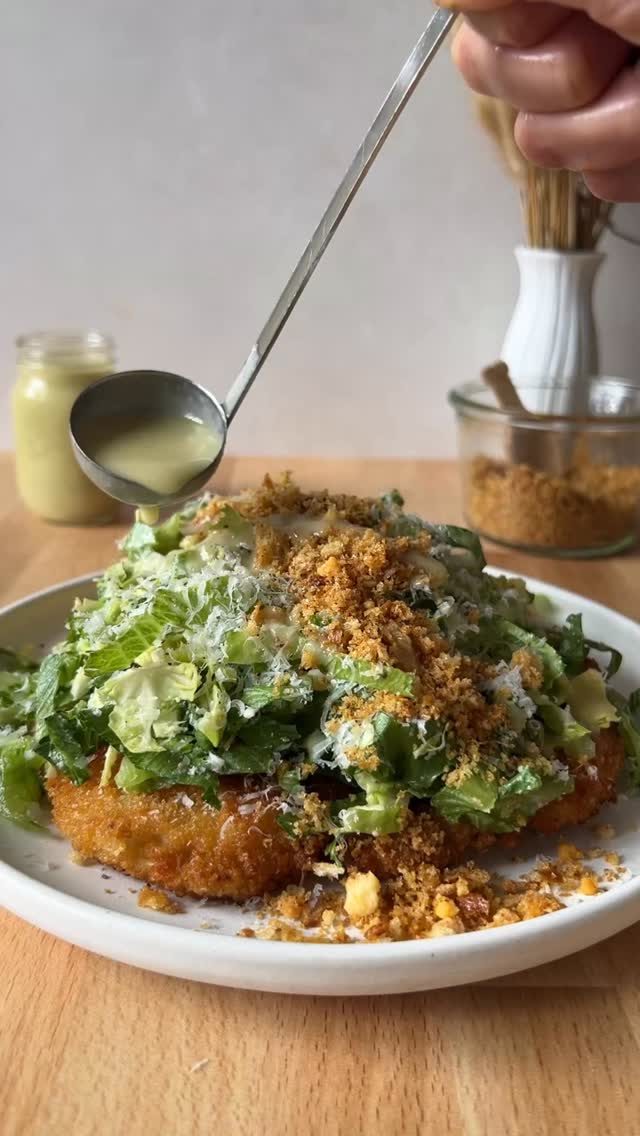 Smashed Brussels Sprout Caesar Salad
(Serves 3-4)

12-15 large Brussels sprouts
4 pieces of old hard bread (dry out in 200° (F) oven if it’s not hard enough)
3 tbsp extra-virgin olive oil
1/2-3/4 tsp seasoned salt (if you don’t have use scant 1/4 tsp each granulated garlic and smoked paprika, 1/8 tsp sugar and kosher salt to taste)
3 tbsp grated Pecorino cheese (the kind that looks like sand- @locatellicheese_official is my favorite!)
3 oz. block of Parmigiano Reggiano cheese (for grating on top of salad)
6 cups chopped romaine (from 2-3 romaine hearts)
One batch Eggless Caesar Dressing (recipe below)

Make a v-shaped cut into each of the Brussels sprouts to remove each core. Smash them one at a time using a heavy bottomed pot (I smash each sprout about 3-4 times). Break the Brussels sprouts apart into their individual leaves, wash and dry, season lightly with salt and set aside.  Preheat oven to 350°F and line a small sheet pan with parchment. Break bread into 2-3 inch pieces and pulse in a food processor until crumbs are just smaller than a pencil eraser. Sift out any floury bits.T oss crumbs with oil, seasoned salt, and 3 tbsp grated Parmesan. Spread on the pan and bake 15 min, stirring once or twice. Cool completely. Coarsely chop Brussels sprouts and combine with lettuce in a large bowl with appx. ⅓ cup dressing. Toss gently. Add ½ cup grated (sandy) cheese, toss again, and taste. Adjust with more dressing and cheese as you like. Finish with cheesy breadcrumbs and a shower of fresh Parmesan.

EGGLESS CAESAR DRESSING
(Makes 1 1/4 cups)

4 tbsp lemon juice
1 tbsp capers, drained
1/2 tbsp Dijon mustard
3 peeled garlic cloves
1/2 tsp Worcestershire sauce 
2/3 cup neutral flavored oil (such as avocado or grapeseed)
2 tbsp extra virgin olive oil
3 cloves garlic, peeled
S&P

Add the lemon juice, garlic, capers, Dijon mustard and worcestershire sauce to a blender, or a pint sized receptacle, if using an immersion  blender. Blend until the garlic and capers are finely chopped. With the blender motor running, drizzle in the neutral oil, then the olive oil, and season to taste. 

P.S If you missed my Chicken Cutlet tutorial, comment CHICKEN and I’ll send it to ya!