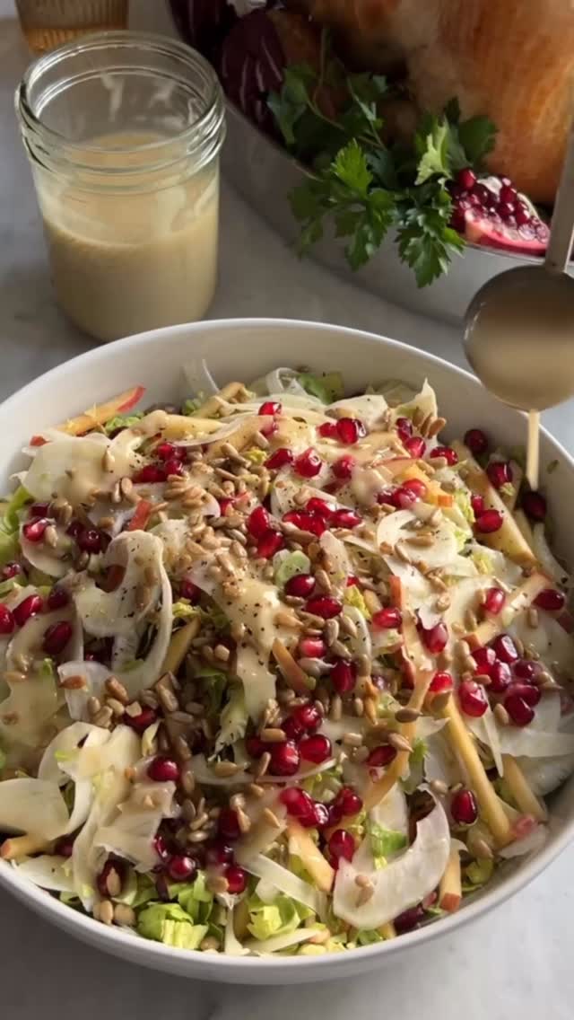 Fennel and Apple Slaw with Brussels Sprouts and Pomegranate
(Serves 6-8)

2 large fennel bulbs 
2 lemons
2 large apples
12 large Brussels sprouts, smashed and broken into individual leaves 
1/2 cup pomegranate arils 
Kosher salt
Black pepper
1/3 cup sunflower seeds
Maple Mustard Vinaigrette (recipe below)

Cut the base and the fronds from the fennel bulbs. Slice vertically in half and remove the fennel cores. Using your mandoline slicer (and a cut glove) thinly slice the fennel lengthwise on the thinnest setting to give you long, straight-ish pieces. Place in a large bowl. Juice both lemons into appx. one quart of water in a medium bowl. Julienne the apples and add to the bowl. Make a v-shaped cut into each of the Brussels sprouts to remove their cores. Smash them one at a time using a sturdy small fry pan. Break Brussels sprouts apart into their individual leaves, then roughly chop the leaves. Add to the fennel in the bowl. Drain the apples and add to the bowl. Add the pomegranate arils, dress, and season to taste. Garnish with sunflower seeds. 

Maple Mustard Vinaigrette 

1-2 garlic cloves
1 1/2 tbsp maple syrup 
2 tsp Dijon mustard
6 tbsp apple cider vinegar
6 tbsp grapeseed or other neutral flavored oil
2 tbsp extra virgin olive oil
Kosher salt 
black pepper

Place Dijon mustard, maple syrup, garlic and vinegar in a pint sized mason jar. Using an immersion blender (you could also use a regular, top loading blender), blend until combined. While blending, slowly drizzle in the grapeseed oil first, then the olive oil, to emulsify into the dressing. Season to taste with Kosher salt and black pepper.