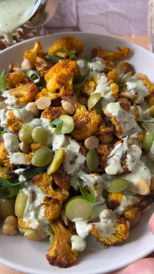 DAY 10 of the 24 DAYS OF DRESSING! Recipe below! Also, comment BOOK for a chance to win one of the 24 free copies of my cookbook, titled Salad Whisperer. 

Roasted Cauliflower Potato and Chickpea Salad with Garlic Herb Tahini Dressing
1/2 tsp ground turmeric
1/2 tsp smoked paprika
1/2 tsp granulated garlic
scant 1/2 tsp Kosher salt, plus extra for seasoning
1 medium head cauliflower
2-3 tbsp olive oil
1 lb. Baby potatoes, boiled and cooled
1 1/2 cups thinly sliced celery
1 1/2 cups of chickpeas, coarsely chopped
3 scallion tops, sliced
1/2 cup sliced Castelvetrano olives
 Place small sheet pan on middle rack in oven and preheat to 450°. Cut
cauliflower into 1 inch florets. Rub cauliflower with olive oil and sprinkle with turmeric, paprika, garlic and salt. Once oven is preheated, carefully remove pan and place cauliflower onto pan. The sizzle is critical! Place pan back in oven. Cook cauliflower for 26 minutes total, flipping once. VERY IMPORTANT STEP: Once or twice during cook time, carefully crack open oven door just long enough to release any steam that has built up in oven (lean to the side so the steam doesn’t hit you in the face). This ensures that cauliflower cooks primarily via searing instead of steaming. Remove from oven and allow to cool for 5-10 minutes on sheet pan before serving. This will allow it to release its death grip on the pan. Combine cauliflower, potatoes, celery, chickpeas, scallion and olives. Dress and season to taste. 

Garlic Herb Tahini Dressing
1/2 cup tahini
1/2 cup cool water
1/4 cup lemon juice
1 garlic clove
2 tbsp olive oil
2 cups your favorite fresh herbs (I used parsley, dill and basil), coarsely chopped
1 tsp kosher salt

Prepare dressing by combining tahini, water, lemon juice, garlic and Kosher salt in your immersion blender carafe (you could also use a regular blender or food processor). Blend until homogenous then drizzle in the olive oil with motor still running.  Add fresh herbs and process until smooth, adding more water if necessary.  #thesaladwhisperer #recipeadventcalendar