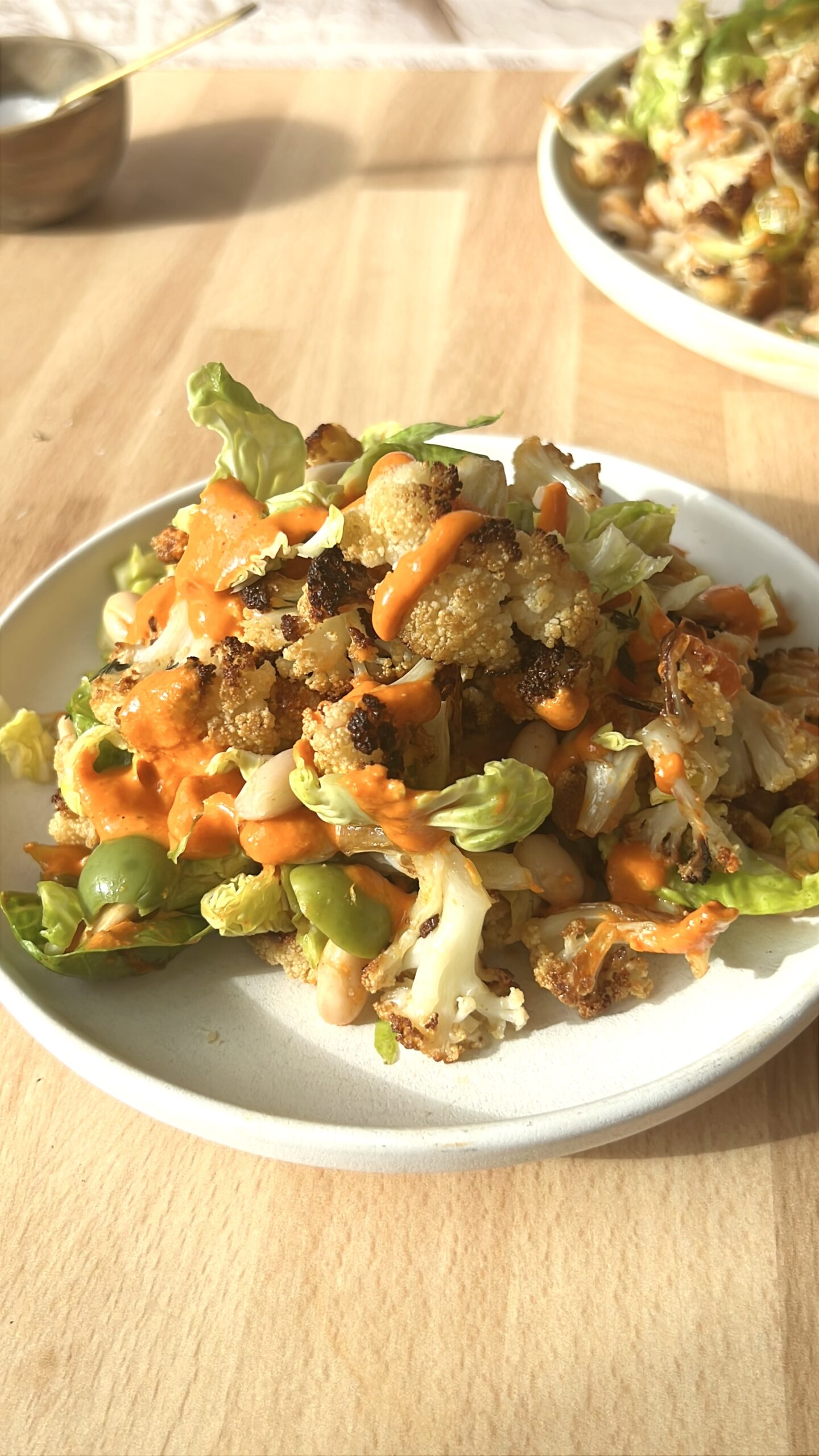 Caramelized Cauliflower Smashed Brussels Sprout and White Bean Salad with Romesco-ish Dressing