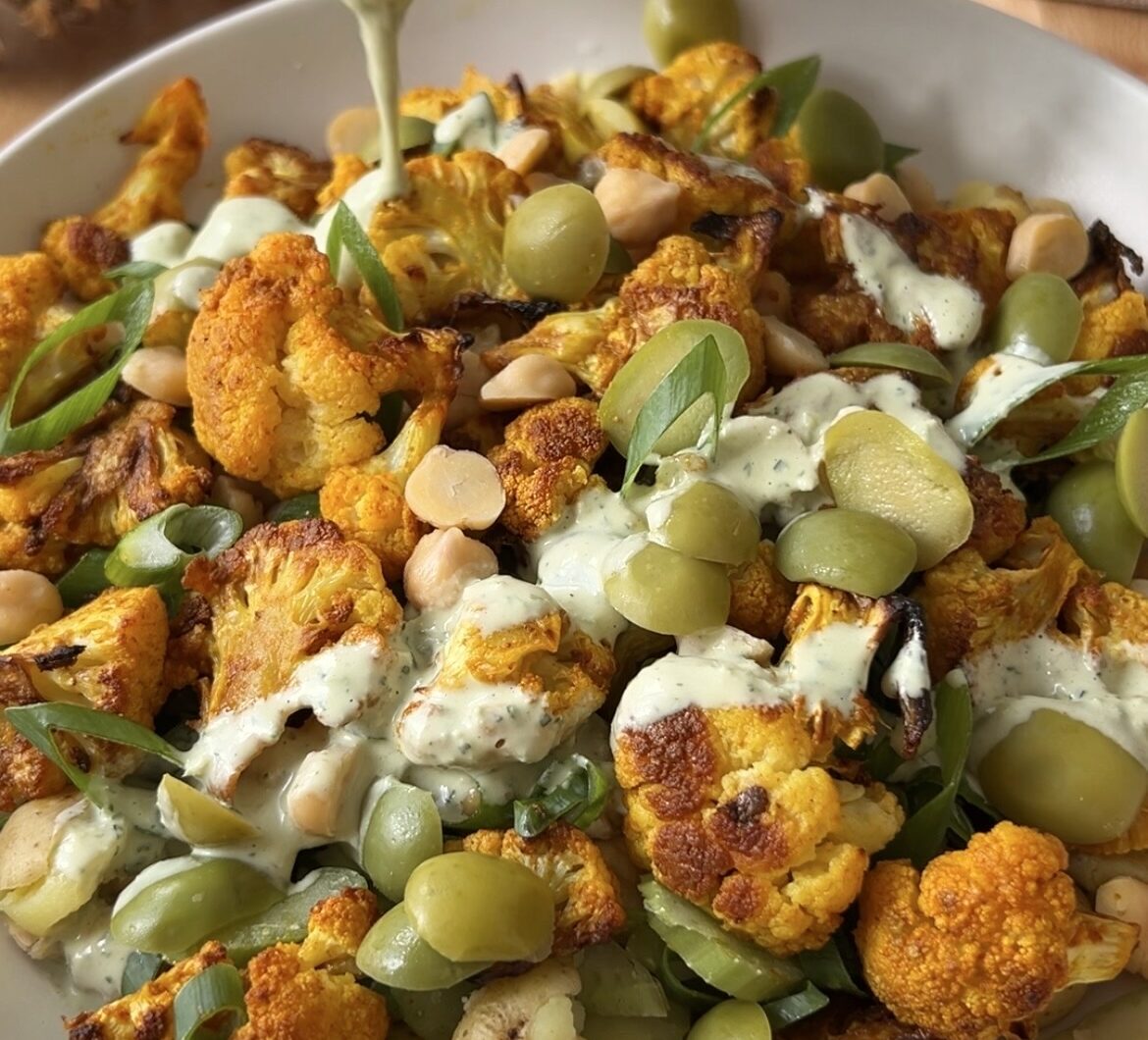 Roasted Cauliflower Potato and Chickpea Salad with Garlic Herb Tahini Dressing