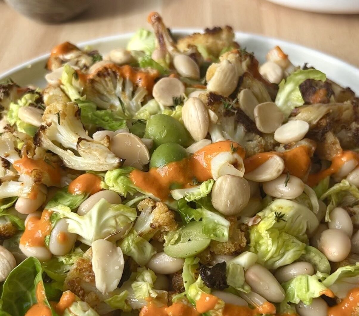 Roasted Cauliflower Salad with Smashed Brussels Sprouts White Beans and a Smoky Romesco-ish Dressing