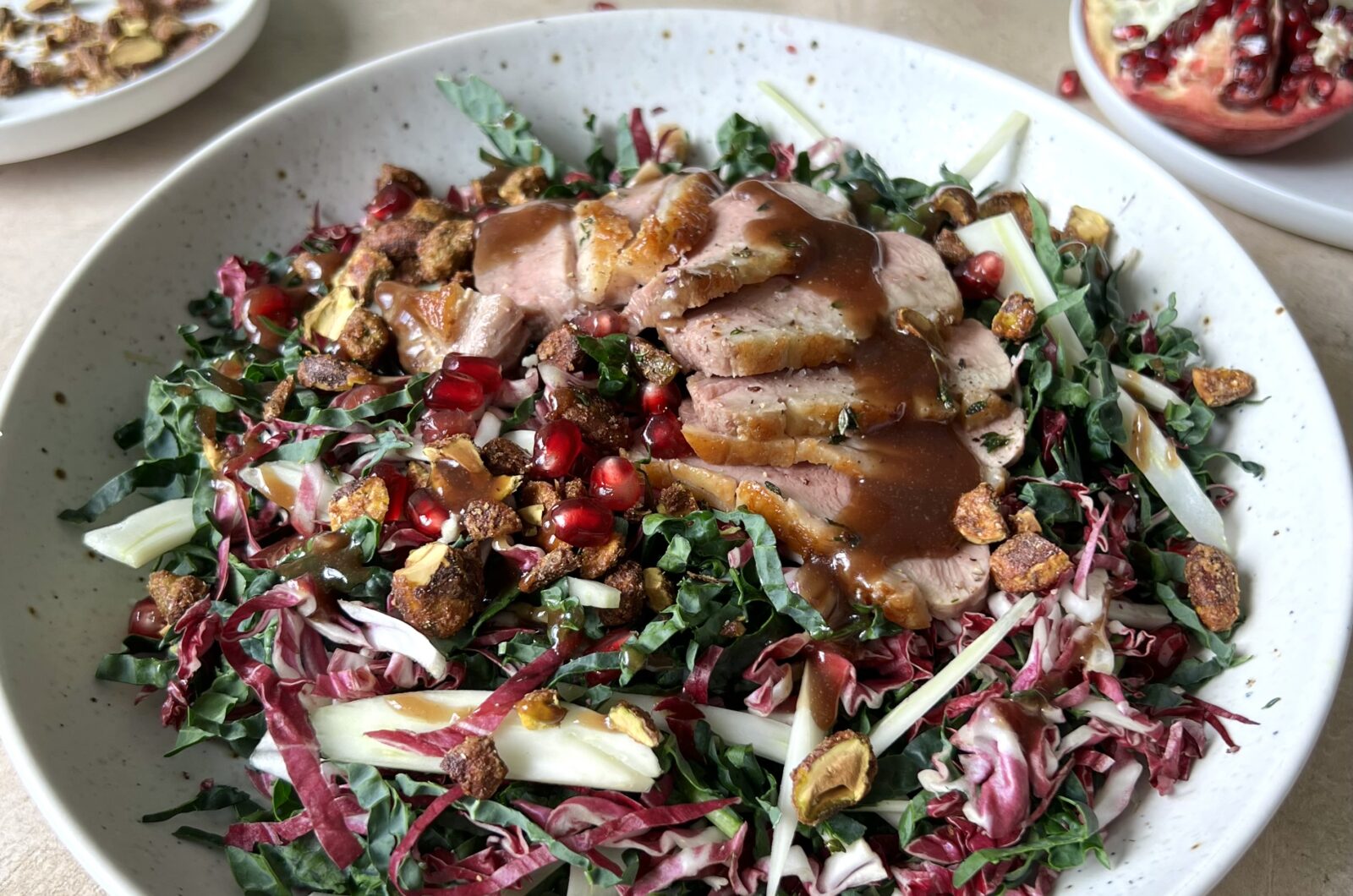 Crispy Duck Salad with Kale Fennel Candied Pistachios and Pomegranate Vinaigrette