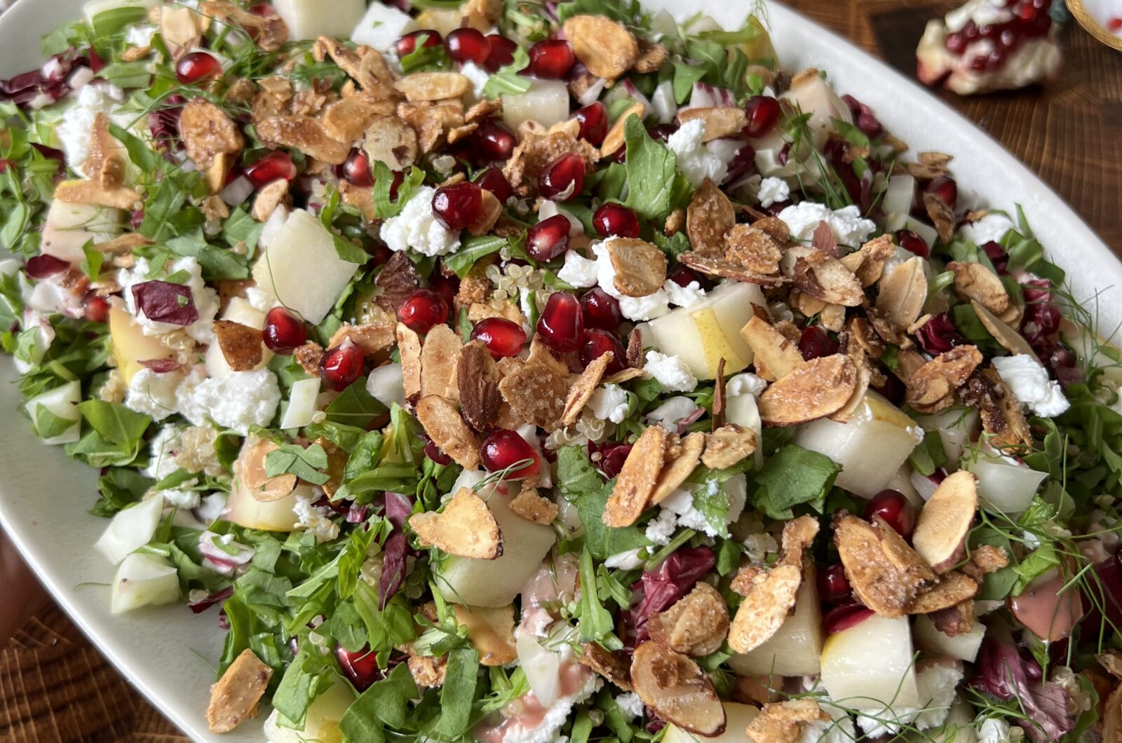 Arugula Pear and Fennel Salad with Spiced Almonds Goat Cheese and Pomegranate Poppyseed Dressing
