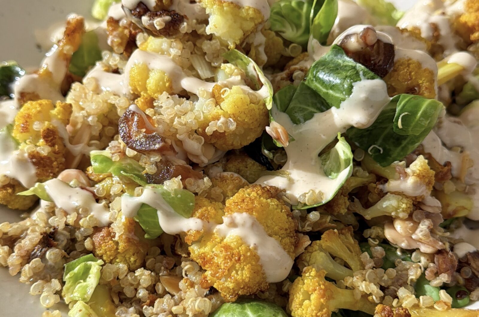 Carmelized Cauliflower and Brussels Sprout Salad with Dates, Almonds and (Just a Little) Spicy Tahini Dressing